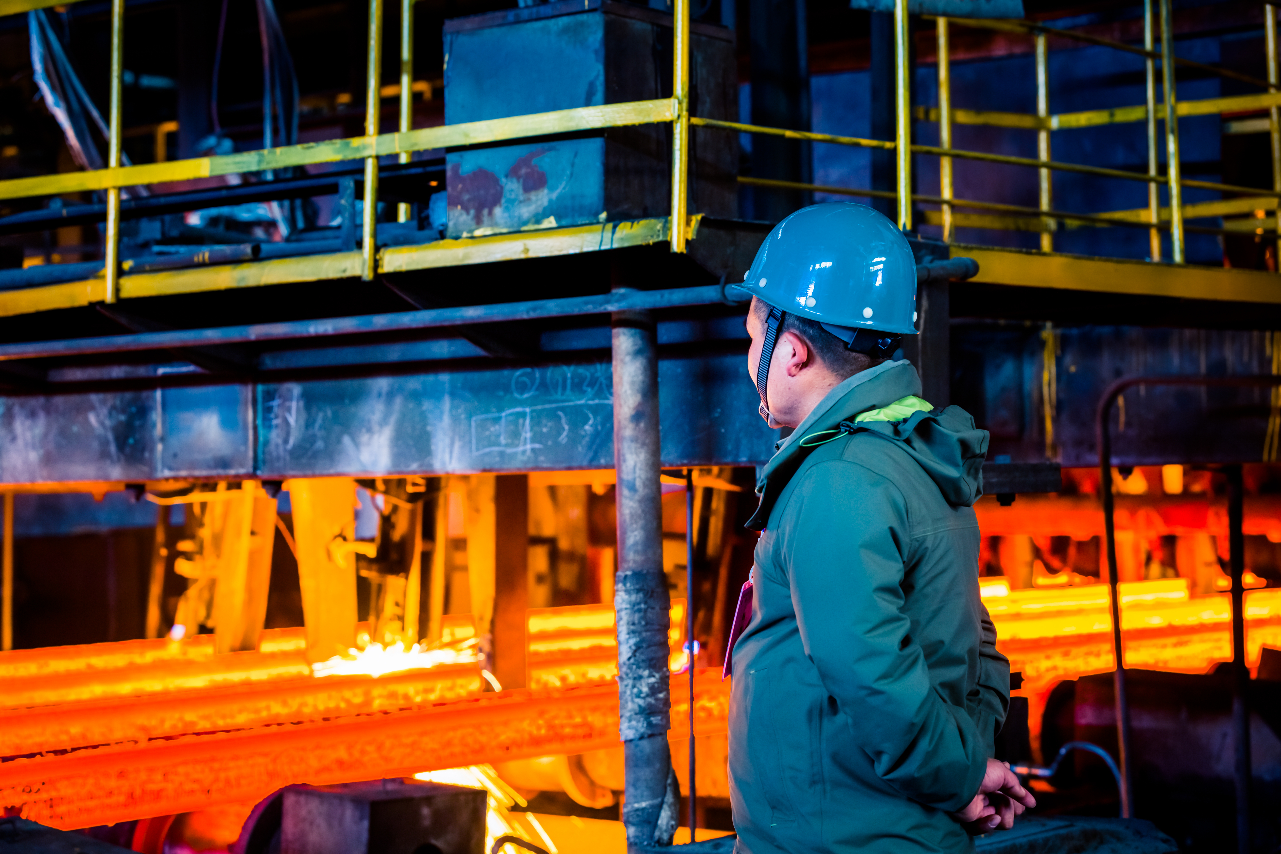 Worker monitoring industrial manufacturing process